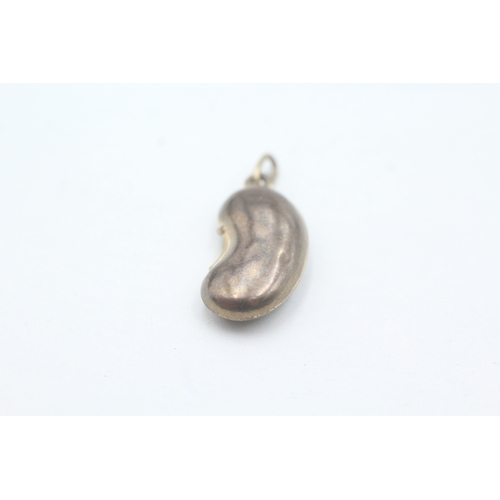 63 - 9ct gold vintage lucky bean charm (0.8g)