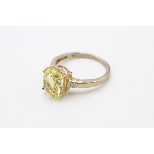 71 - 9ct gold citrine single stone ring with diamond sides (2.9g) Size N