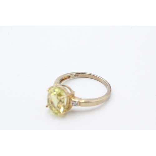 71 - 9ct gold citrine single stone ring with diamond sides (2.9g) Size N