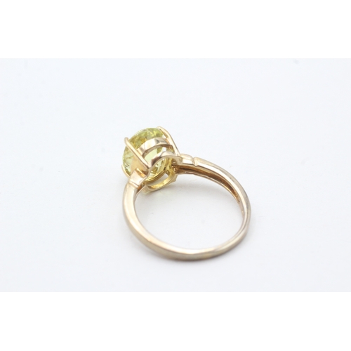 71 - 9ct gold citrine single stone ring with diamond sides (2.9g) Size N