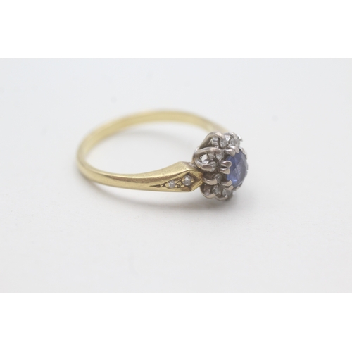 77 - 18ct gold sapphire and diamond halo ring (3.9g) Size Q