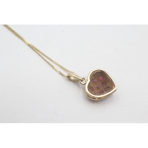 89 - 9ct gold ruby and diamond heart pendant on chain (2.1g)