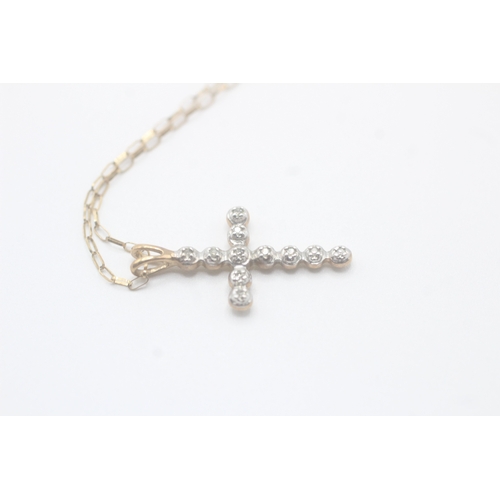 93 - 9ct gold diamond cross pendant on chain (1.6g)