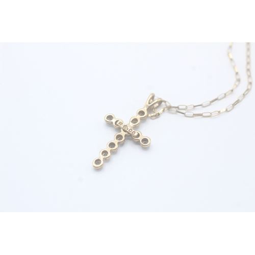 93 - 9ct gold diamond cross pendant on chain (1.6g)