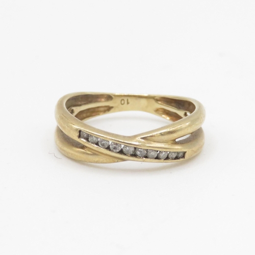 102 - 9ct gold diamond channel ring (2.1g) Size K