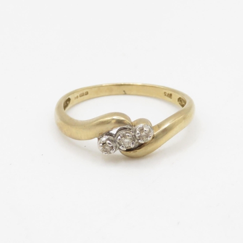 36 - 9ct gold diamond three stone twist ring (2.1g) Size Q