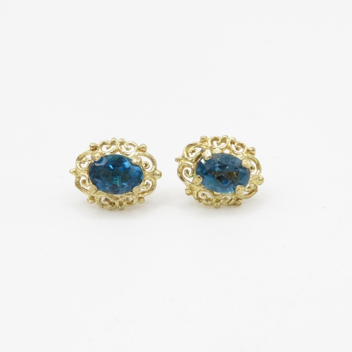 69 - 9ct gold blue topaz stud earrings (1.8g)