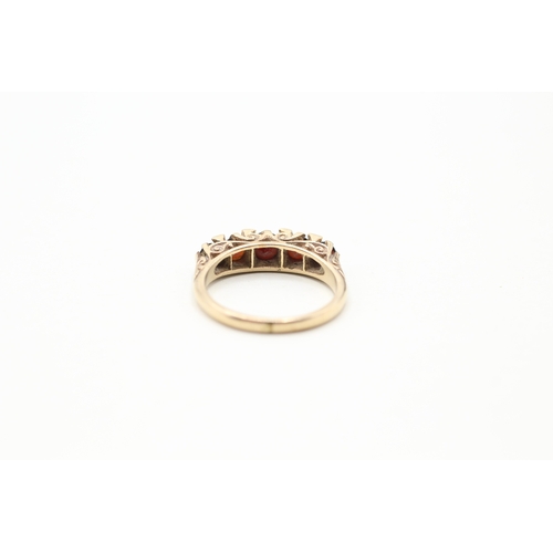 104 - 9ct gold garnet five stone ring (3.2g) Size M 1/2