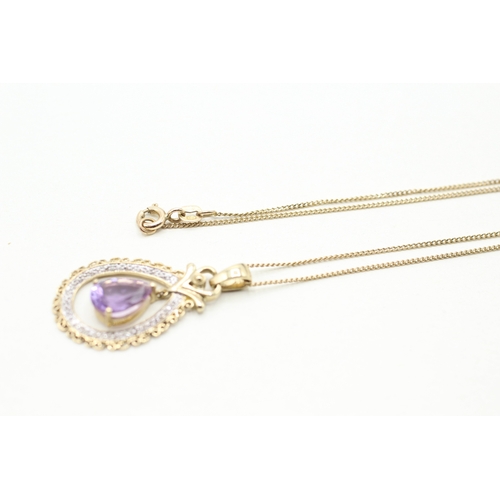 109 - 9ct gold amethyst and diamond framed drop pendant on chain (4g)