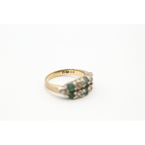 111 - 9ct gold emerald and diamond twin row ring (3.3g) Size J