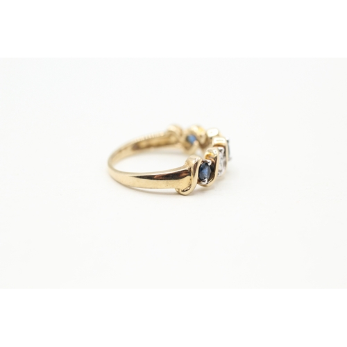 27 - 9ct gold diamond and sapphire row ring (2.8g) Size M