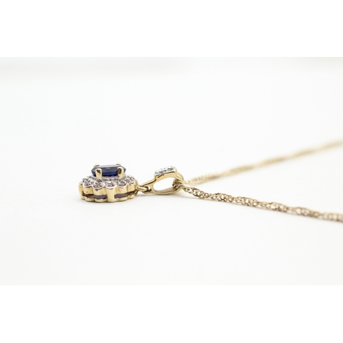 28 - 9ct gold blue gemstone and diamond halo pendant on chain (3.3g)