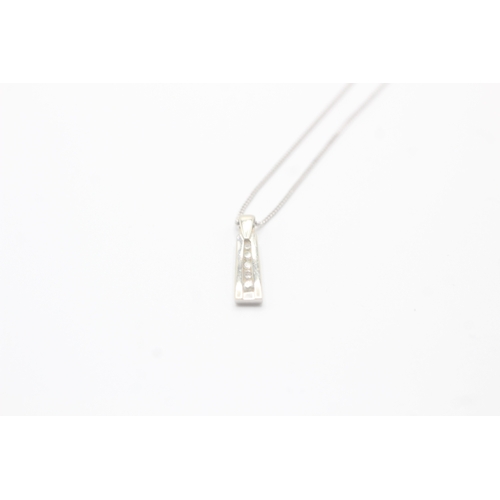 39 - 9ct white gold diamond drop pendant on chain (2.4g)