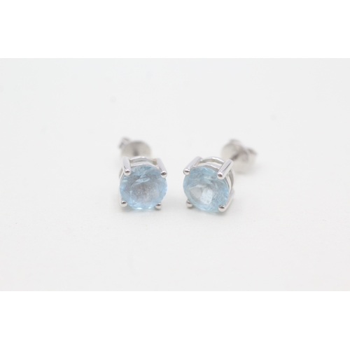 60 - 18ct gold blue topaz stud earrings (2.6g)