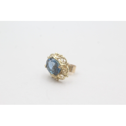 69 - 9ct gold blue topaz stud earrings (1.8g)