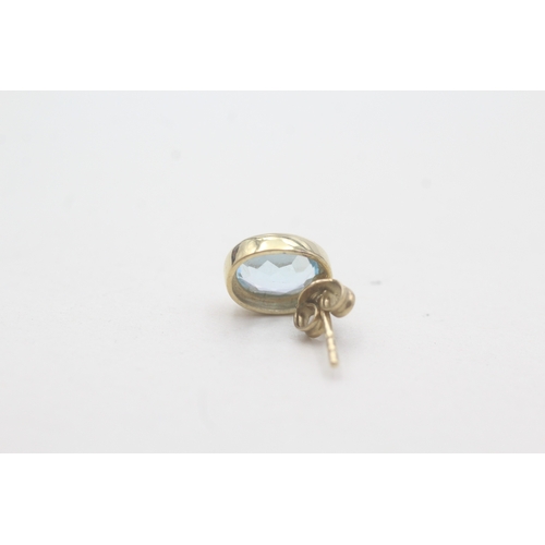 74 - 9ct gold blue topaz stud earrings (1.9g)