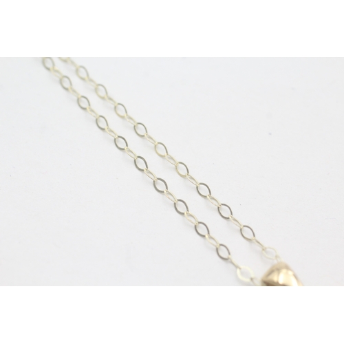 75 - 9ct gold blue quartz pendant on chain (3.1g)