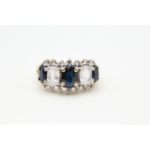 81 - 9ct gold diamond, white and blue sapphire row ring (4.2g) Size O