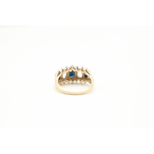 81 - 9ct gold diamond, white and blue sapphire row ring (4.2g) Size O