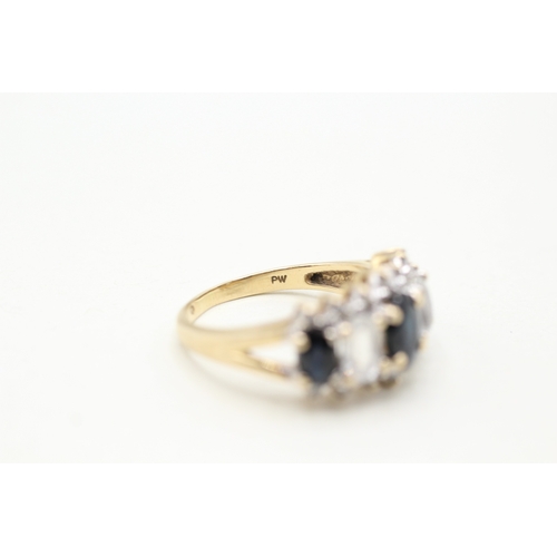 81 - 9ct gold diamond, white and blue sapphire row ring (4.2g) Size O