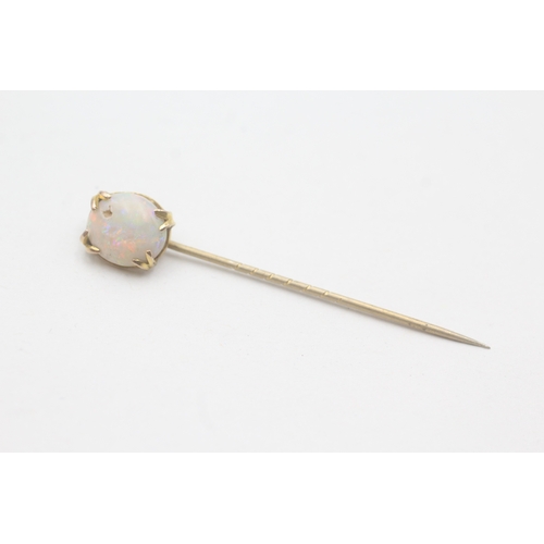 86 - 9ct gold opal stick pin with basemetal pin (1.4g)