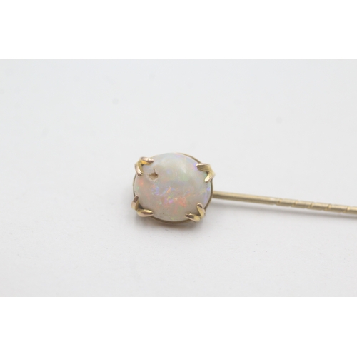 86 - 9ct gold opal stick pin with basemetal pin (1.4g)