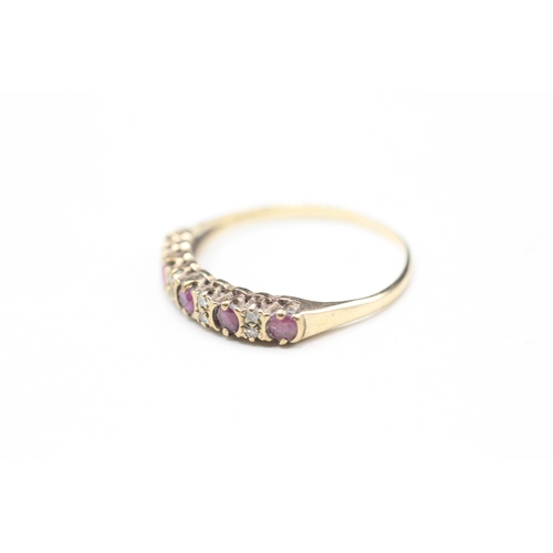 93 - 9ct gold ruby five stone ring with double diamond spacers (1.3g) Size P 1/2