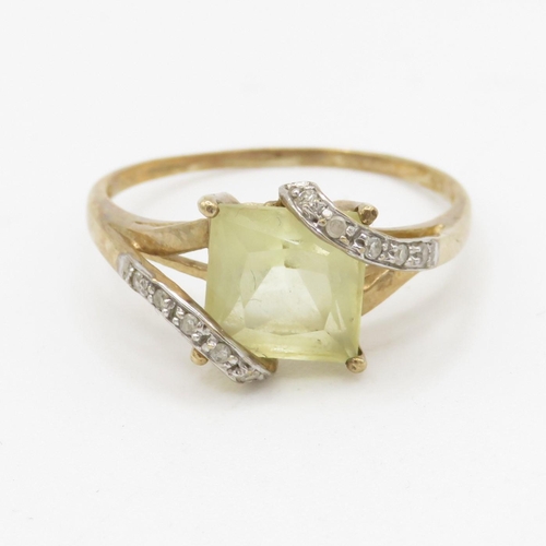 246 - 9ct gold diamond and yellow gemstone set ring (2.3g)  Size S