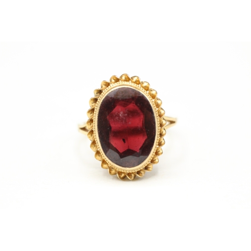 100 - 9ct gold garnet single stone ring (3.4g) Size M