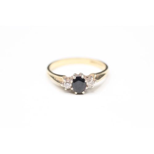 103 - 9ct gold diamond & sapphire three stone ring (2.4g) Size N