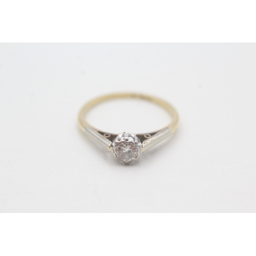 107 - 18ct gold and platinum diamond solitaire ring (1.8g) Size M