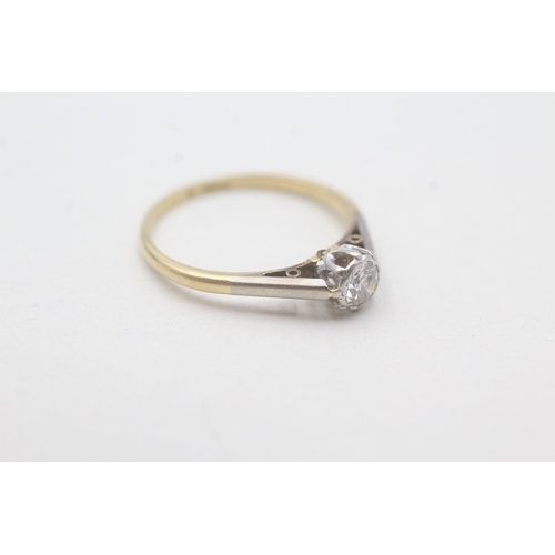 107 - 18ct gold and platinum diamond solitaire ring (1.8g) Size M