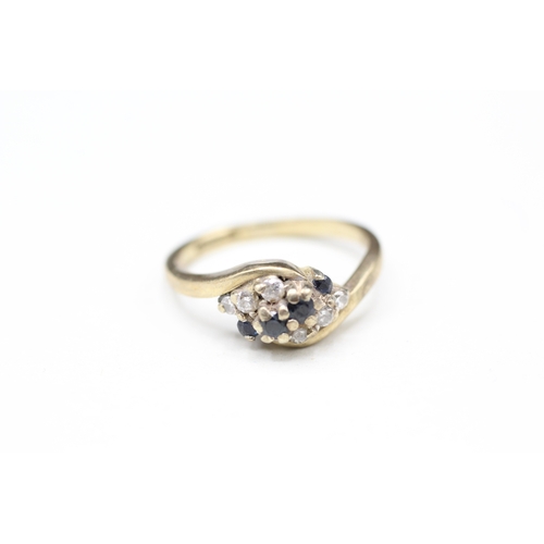 122 - 9ct gold sapphire and diamond twist ring (2.8g) Size L