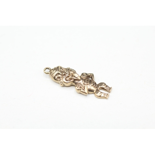 128 - 9ct gold figure charm (2g)