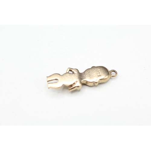 128 - 9ct gold figure charm (2g)