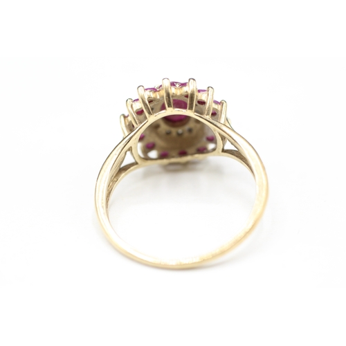 14 - 9ct gold ruby and diamond halo ring (3.5g) Size R