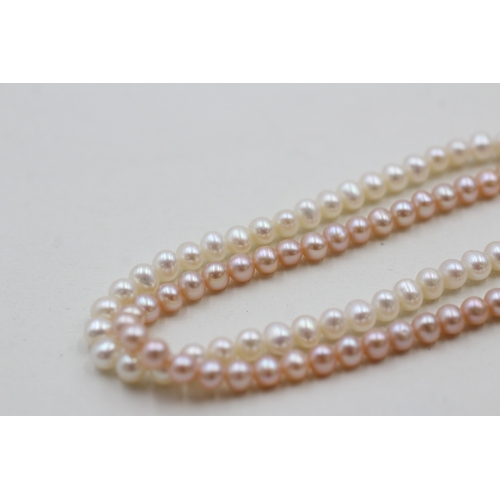 146 - 9ct gold twin strand cultured pearl bracelet (10.7g)