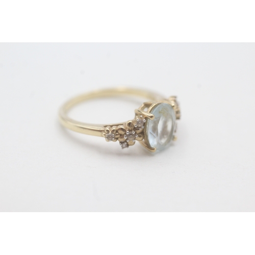 166 - 9ct gold aquamarine and white gemstone ring (2.9g) Size O