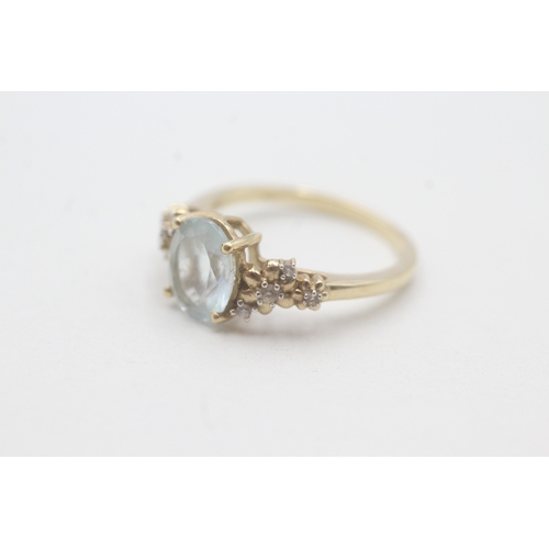 166 - 9ct gold aquamarine and white gemstone ring (2.9g) Size O