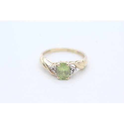 167 - 14ct gold peridot single stone ring with diamond accents (2.5g) Size M 1/2