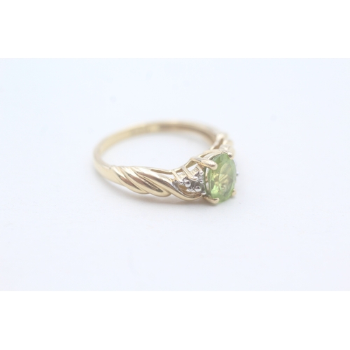 167 - 14ct gold peridot single stone ring with diamond accents (2.5g) Size M 1/2