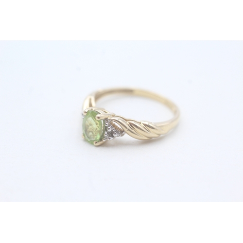 167 - 14ct gold peridot single stone ring with diamond accents (2.5g) Size M 1/2