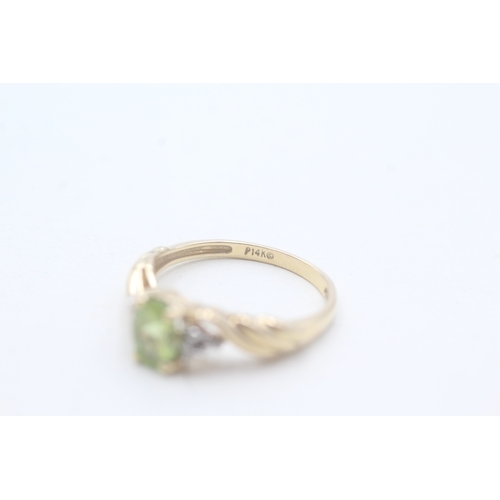 167 - 14ct gold peridot single stone ring with diamond accents (2.5g) Size M 1/2