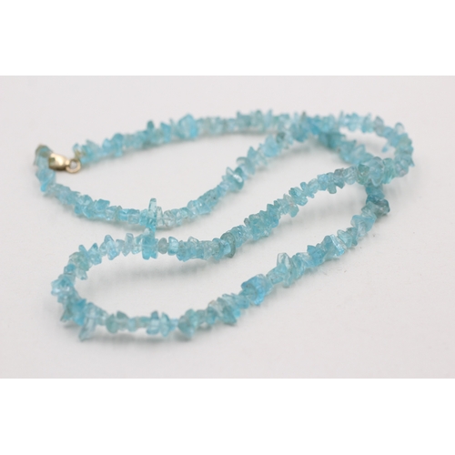 168 - 9ct gold blue gemstone necklace (16.4g)