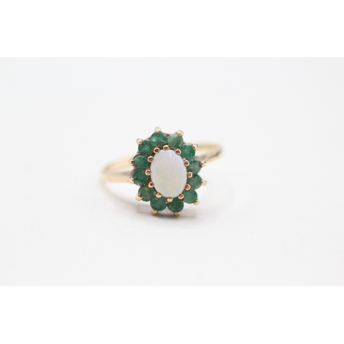 174 - 9ct gold opal and emerald halo set ring (2.2g) Size O