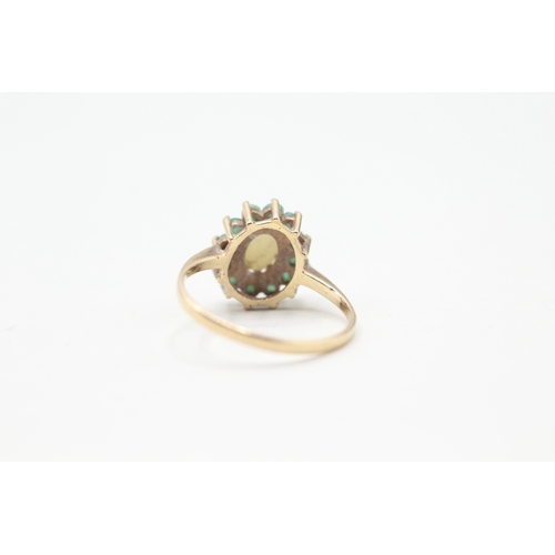 174 - 9ct gold opal and emerald halo set ring (2.2g) Size O