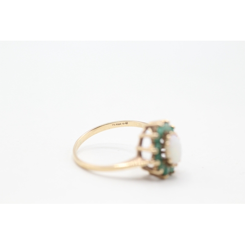 174 - 9ct gold opal and emerald halo set ring (2.2g) Size O