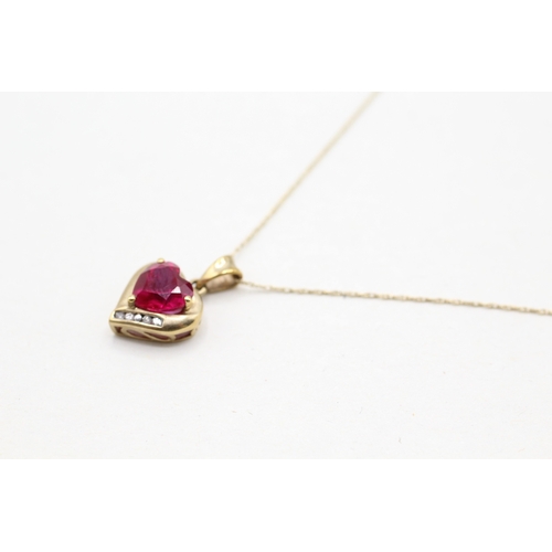 176 - 9ct gold red gemstone and diamond heart shape pendant on chain (1.6g) Size O 1/2