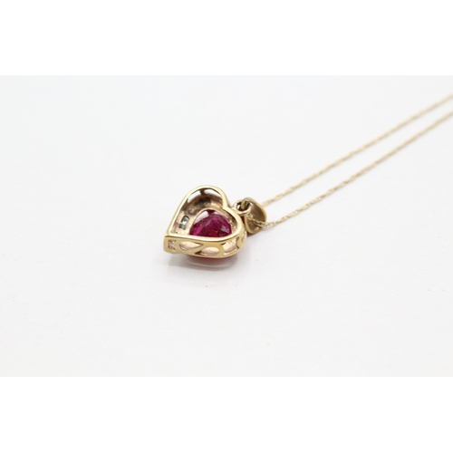 176 - 9ct gold red gemstone and diamond heart shape pendant on chain (1.6g) Size O 1/2