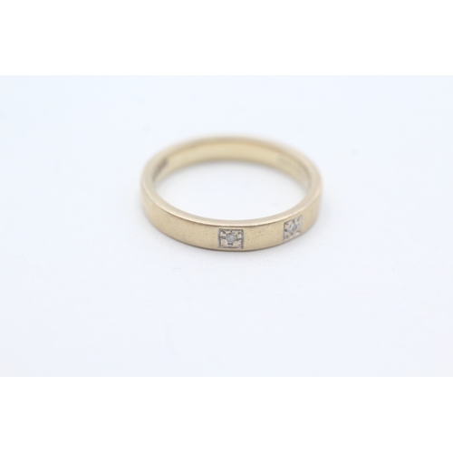 191 - 9ct gold diamond set band ring (2.6g) Size L